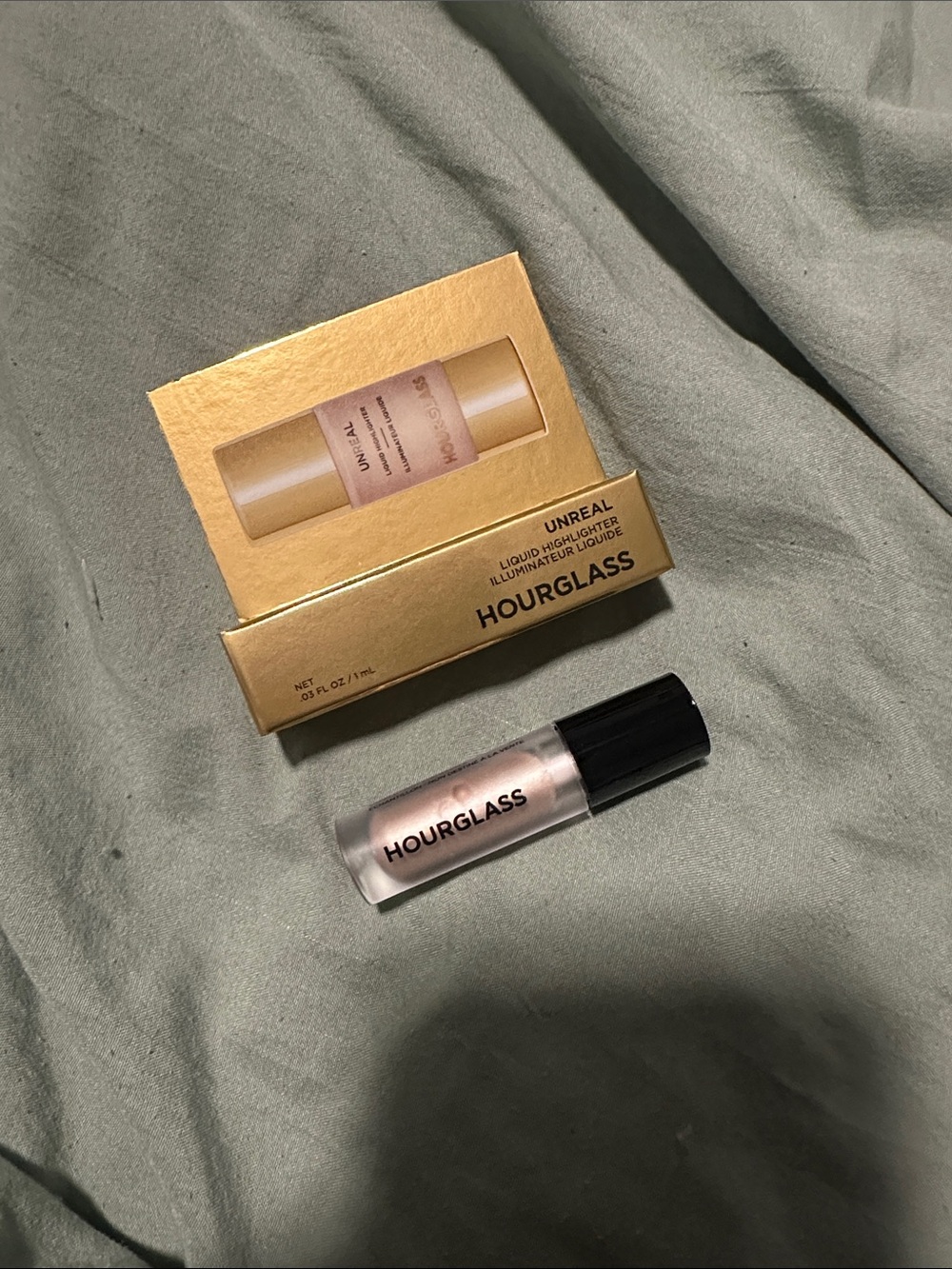 $8 Hourglass unreal liquid highlighter - evoke